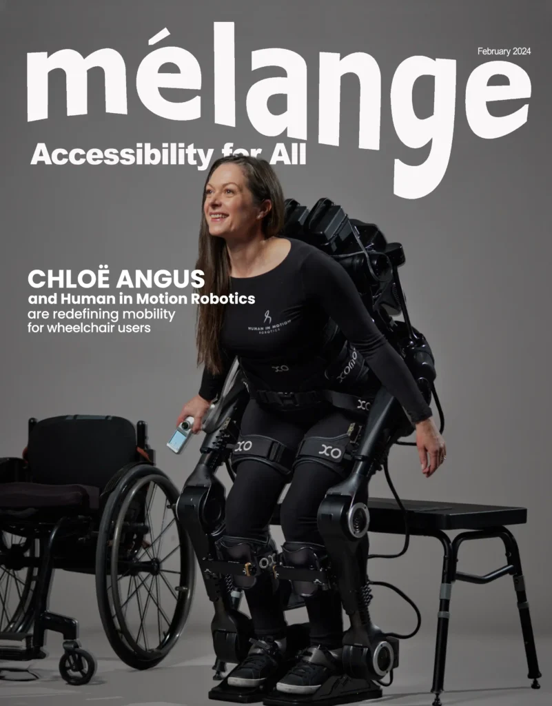 Magazine cover of Mélange, February 2024 edition, featuring Chloë Angus and Human in Motion Robotics. The cover highlights 'Accessibility for All' with a focus on redefining mobility for wheelchair users. Chloë Angus is shown wearing an advanced exoskeleton suit by Human in Motion Robotics, with a wheelchair in the background and a small remote control in her hand. She is in a standing position, looking confident and smiling