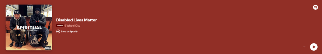 A Spotify music preview for the song 'Disabled Lives Matter' by 4 Wheel City. The album cover features two individuals sitting in wheelchairs in an indoor public space, wearing winter clothing. The text 'SPIRITUAL The Mixtape' is prominently displayed on the album cover. The background of the preview is a deep red color, with Spotify interface elements including a play button and a save option