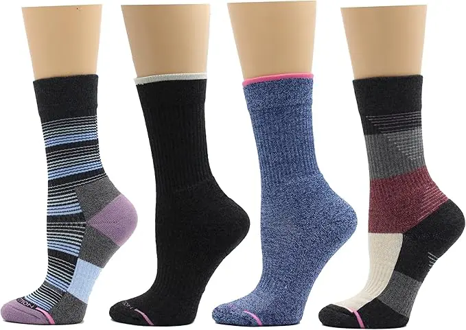 Four pairs of colorful socks displayed on mannequin legs, showcasing various patterns and colors, including stripes and solid shades.