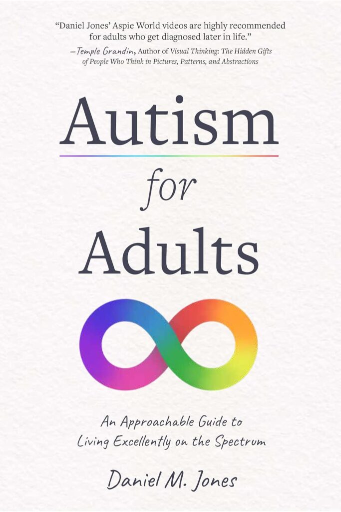 A book cover with a soft gray and white texture. The title "Autism for Adults" is in the center, with "Autism" in a rainbow-colored font and "for Adults" in a gray font. Below the title is a rainbow-colored infinity symbol.