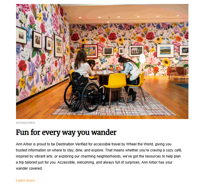 Accessible travel advertisement featuring two women, one using a wheelchair, seated at a round table with two children in a bright, art-filled room with a floral wallpaper, promoting Ann Arbor as a destination for inclusive travel.