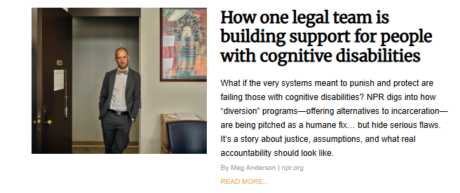 Man in suit and bow tie standing in an office doorway, addressing justice for people with cognitive disabilities through diversion programs.