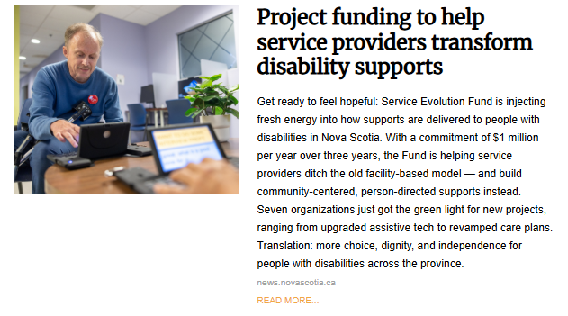 A man with a disability, smiling and focused while typing on a laptop computer, symbolizing project funding for disability support services in Nova Scotia.