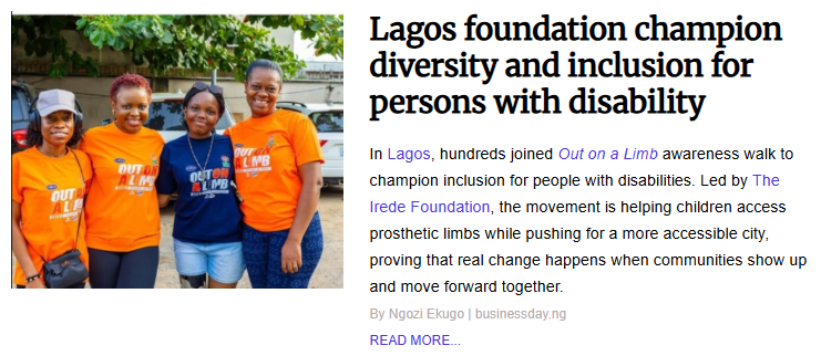 Four women wearing orange and blue "Out on a Limb" t-shirts smiling together at an awareness walk organized by The Irede Foundation for persons with disability in Lagos.