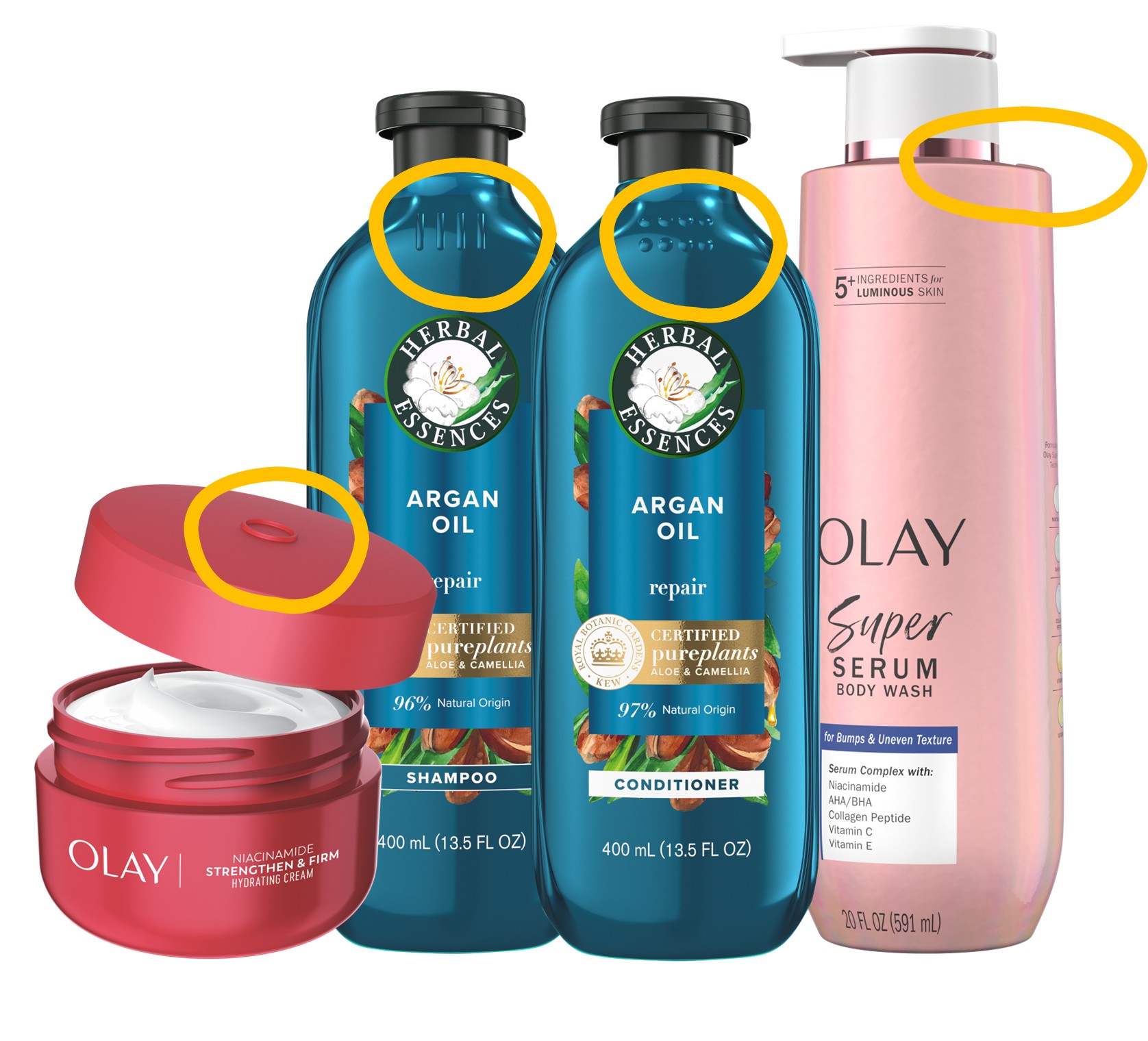 A collection of personal care products including Olay Super Serum body wash, Olay Niacinamide face cream, and Herbal Essences Argan Oil shampoo and conditioner. Yellow circles highlight tactile features like Braille and raised lines on the packaging designed for accessibility for the visually impaired.