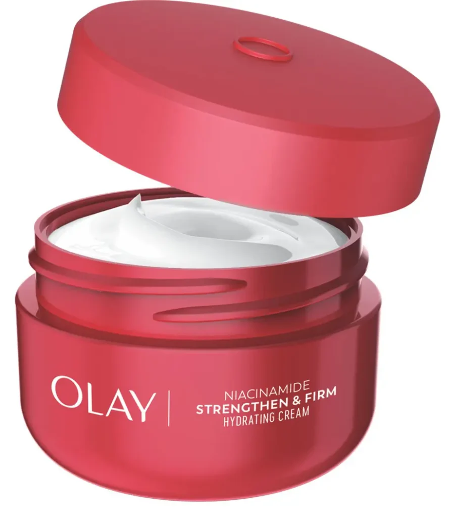 An open red jar of Olay Niacinamide Strengthen & Firm Hydrating Cream, showing the smooth white moisturizing cream inside with the lid hovering above.
