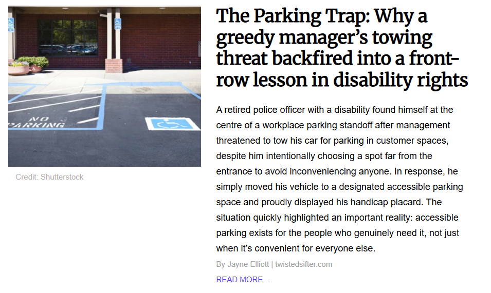 An empty, designated accessible parking space painted with the blue and white international symbol of access in front of a brick commercial building.