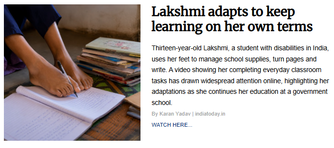 Close-up view of a student using her feet to grip a pen and write on a notebook on the floor next to a stack of textbooks. The image accompanies the article titled "Lakshmi adapts to keep learning on her own terms."