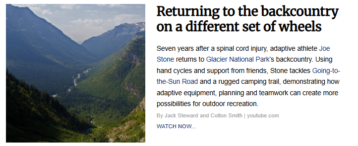 An image accompanying the article "Returning to the backcountry on a different set of wheels," featuring a wide, scenic view of a lush green mountain valley flanked by steep, forested slopes under a partly cloudy sky.